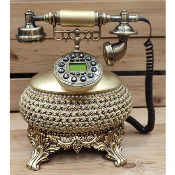 تلفن سلطنتی رومیزی رایکا مدل 310، تلفن سلطنتی با طراحی طرح نقش برجسته روی بدنه تلفن، شماره گیر دکمه ای و دارای کالر آیدی، دکوری شیک و جذاب مناسب منزل و محل کار| رنگ طلایی