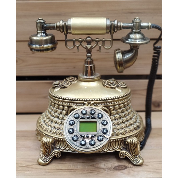 تلفن سلطنتی رومیزی رایکا مدل 320، تلفن سلطنتی با طراحی طرح نقش برجسته روی بدنه تلفن، شماره گیر دکمه ای و دارای کالر آیدی، دکوری شیک و جذاب مناسب منزل و محل کار| رنگ طلایی