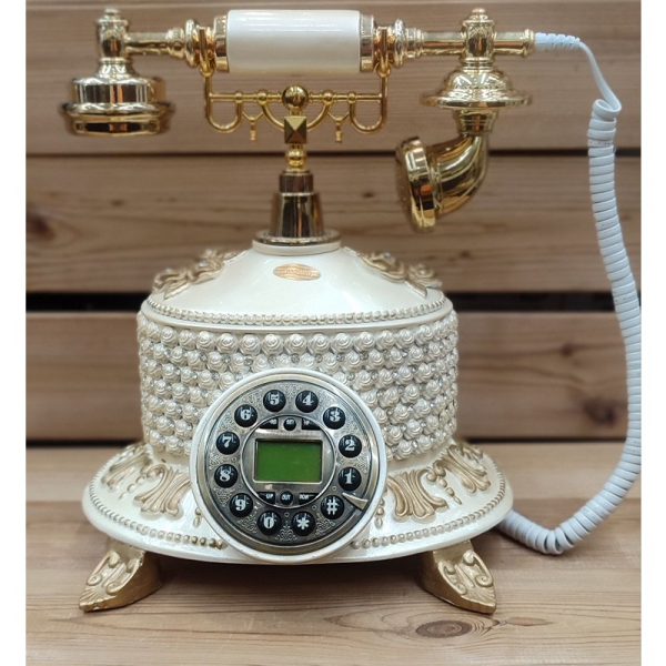 تلفن سلطنتی رومیزی رایکا مدل 330، تلفن سلطنتی با طراحی طرح نقش برجسته روی بدنه تلفن، شماره گیر دکمه ای و دارای کالر آیدی، دکوری شیک و جذاب مناسب منزل و محل کار| رنگ سفید طلایی