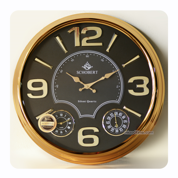 ساعت دیواری فلزی شوبرت مدل 5320 GN، ساعت دیواری سایز 50 با اعداد لاتین درشت وبرجسته، طلایی صفحه مشکی