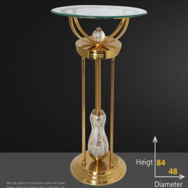 میز کنارسالنی مدل آنیا کد 931، میز زیبا و مدرن با متریال فلز آبکاری شده آنتیک فورتیک، طراحی ظریف و مینیمال با طراحی خلاقانه، سایز 48 سانت رویه شیشه و ارتفاع 84 سانت