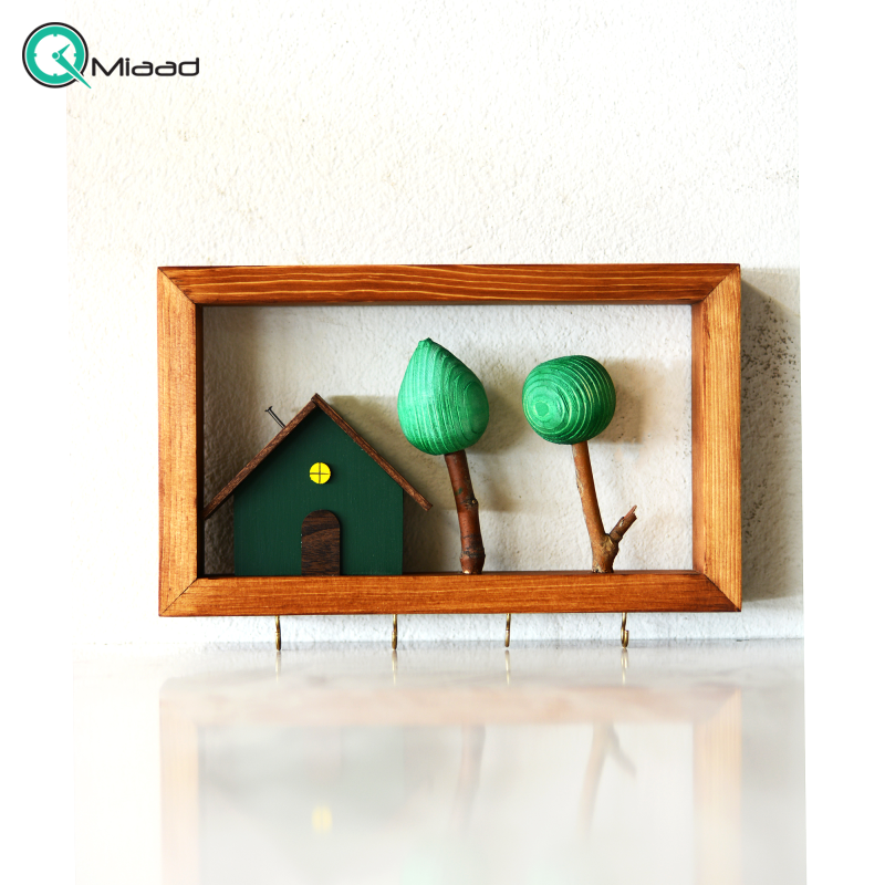 جاکلیدی دست ساز طرح کلبه و درخت با رنگ سبز تیره